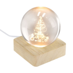 Glazen kerstbol met houten voet en warm licht