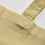 Tas van gerecycled katoen en plastic met bodemvouw 140 g/m² kleur lichtgeel